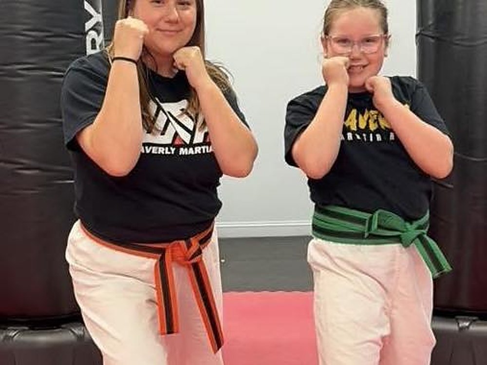 An instructor leading a Hit The Bag. class at Waverly Martial Arts in Patchogue